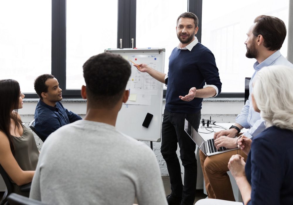 Business team discussing their ideas while working in office together