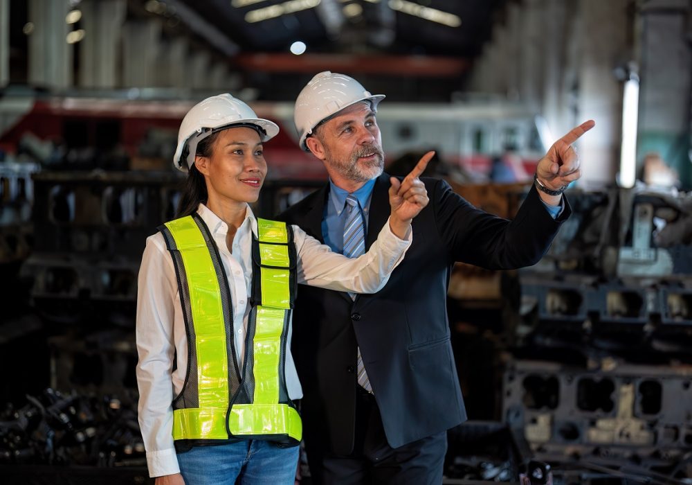 Maintenance manager meet engineer checking part for repair machine and check hand and smile portrait